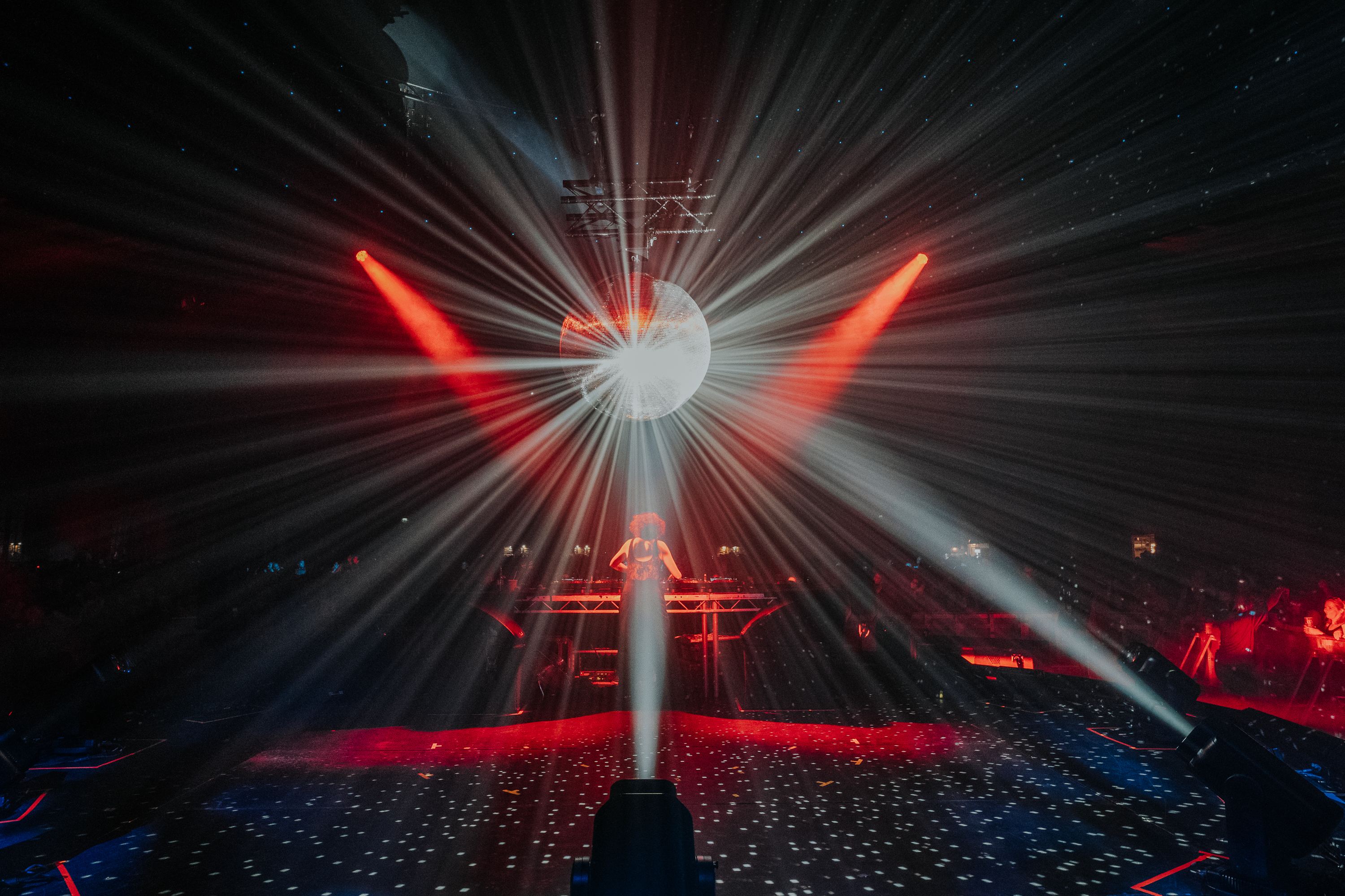 A red starburst over the stage